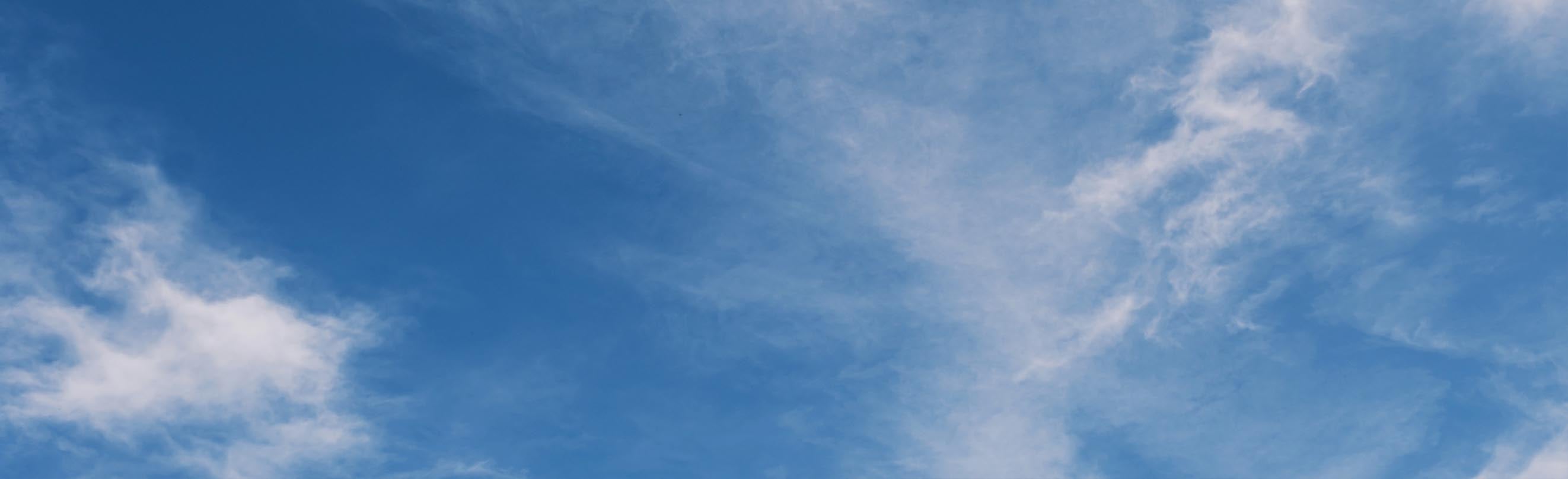 Blue sky with wispy clouds