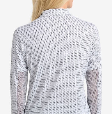 Person wearing a patterned shirt with long sleeves on a white background