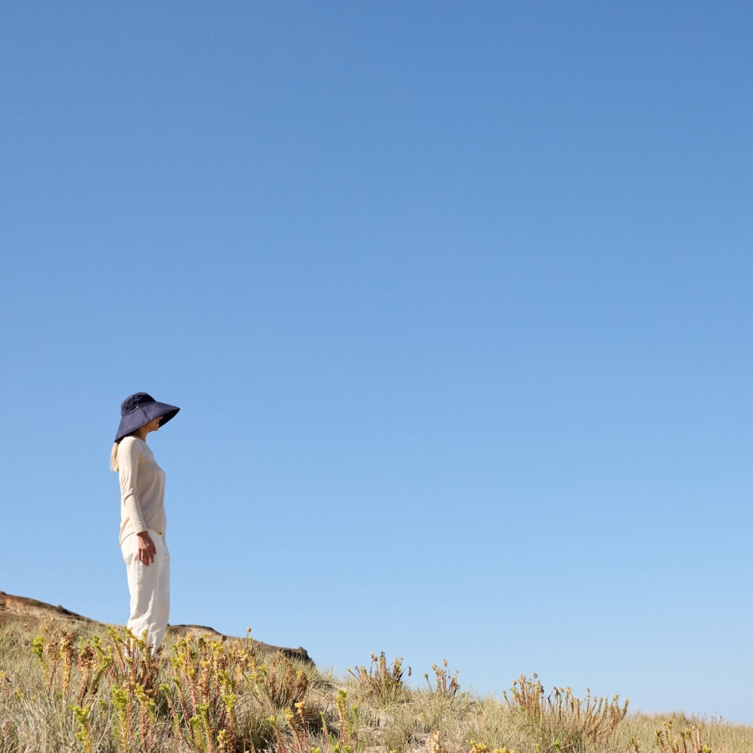 Woman wearing a UPF Solbari hat and clothing